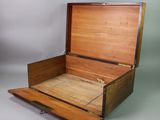 a wooden box that has a drawer inside of it