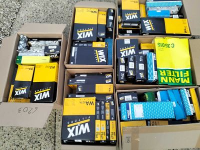 several boxes of various types of electronic equipment are sitting on the ground