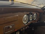 a dashboard of a car with a clock on it