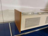 a radio that is sitting on top of a shelf