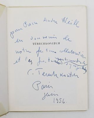 an open book with a handwritten note on the front of it