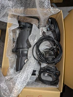 a box with a hair dryer and other items in it