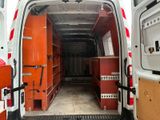 a white van that has a bunch of boxes inside of it