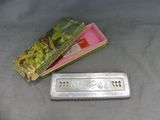 a silver remote control sitting next to a box