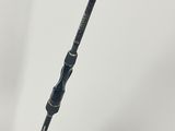 a close up of a fishing rod on a white surface