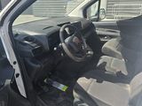 the interior of a car with the door open and the driver ' s seat down