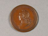an image of a coin with a woman ' s head on it