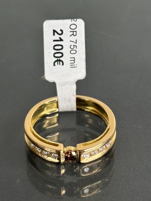an image of a couple of gold rings with diamonds on them