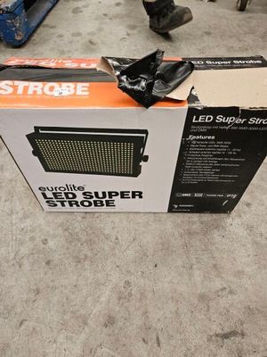 a box that is sitting on the floor next to a pair of shoes