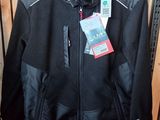 the jacket is hanging on a rack in the store
