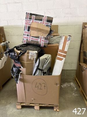 many cardboard boxes stacked on top of each other in a room