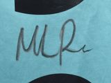 the number five is written on a blue towel with a black and white design