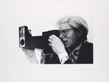 black and white photograph of a man taking a picture with a camera