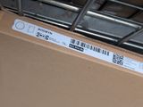 a box with a barcode on it sitting on the floor