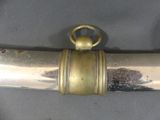 a metal object with a gold ring on it