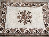 a close up of a rug on the floor in a room