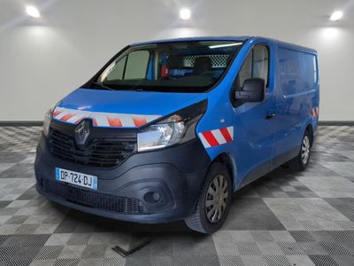 the blue van is parked on a checkered floor in the garage