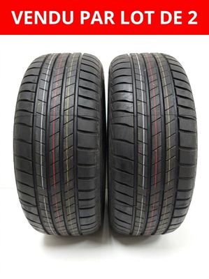 a pair of tires on a white background with the words vendu par lot de 2