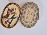 a small box with a picture of a horse and rider on it