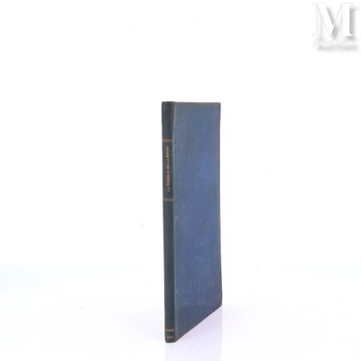 a blue book that is sitting on a white surface