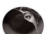 the plate has a picture of a woman ' s face on it