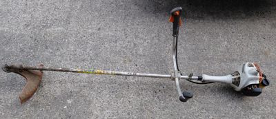 a close up view of a string trimer on the ground