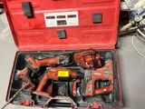 a red tool case with tools in it on a table