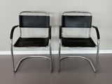 pair of chrome and black leather cantile chairs
