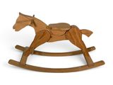 wooden rocking horse on white background with copy space for text