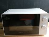 a microwave that is sitting on a wooden table