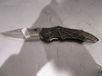a knife that is laying on a table