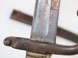 a close up of a metal object with a rusted handle