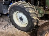 a tractor tire that is sitting on the ground