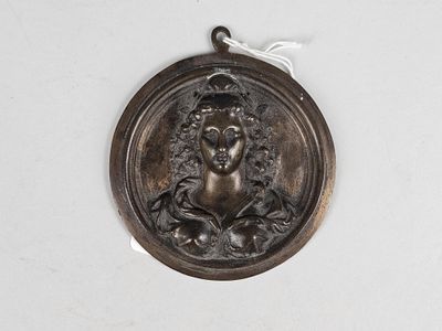 an image of a bronze medal with a woman ' s face on it