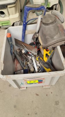 a box full of tools sitting on the floor