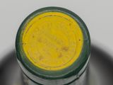 a close up of a wine bottle with a yellow label