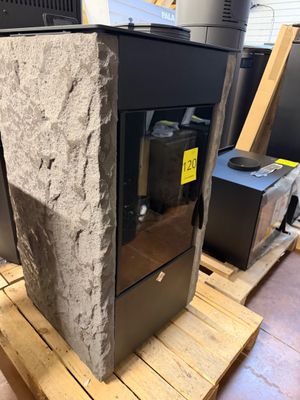 a stone block sitting on top of a wooden pallet