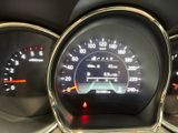 a close up of a car dashboard with various gauges