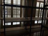 a room that has a bunch of shelves in it