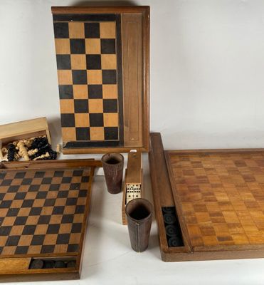 several pieces of wooden chess and checkers laid out on a white surface