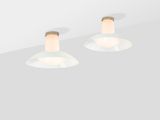 two light fixtures on a ceiling with a white background
