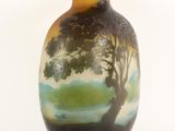 a vase with a painting of a tree on it