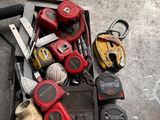 a box of tools sitting on the floor next to a pair of scissors