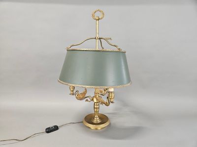 brass table lamp with a green shade and a gold base