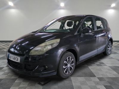 a picture of a small black car parked on a checkered floor