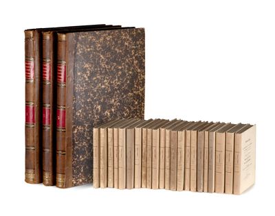 the books are lined up in a row on a white surface