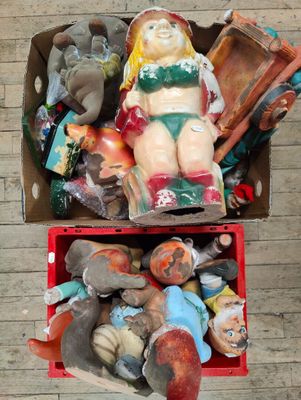 a box full of assorted toys sitting on the floor