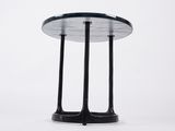 a black table with a glass top on a white background