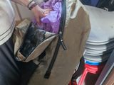 a woman that is holding a bag in her hand