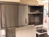 a kitchen with a sink and a microwave in it
